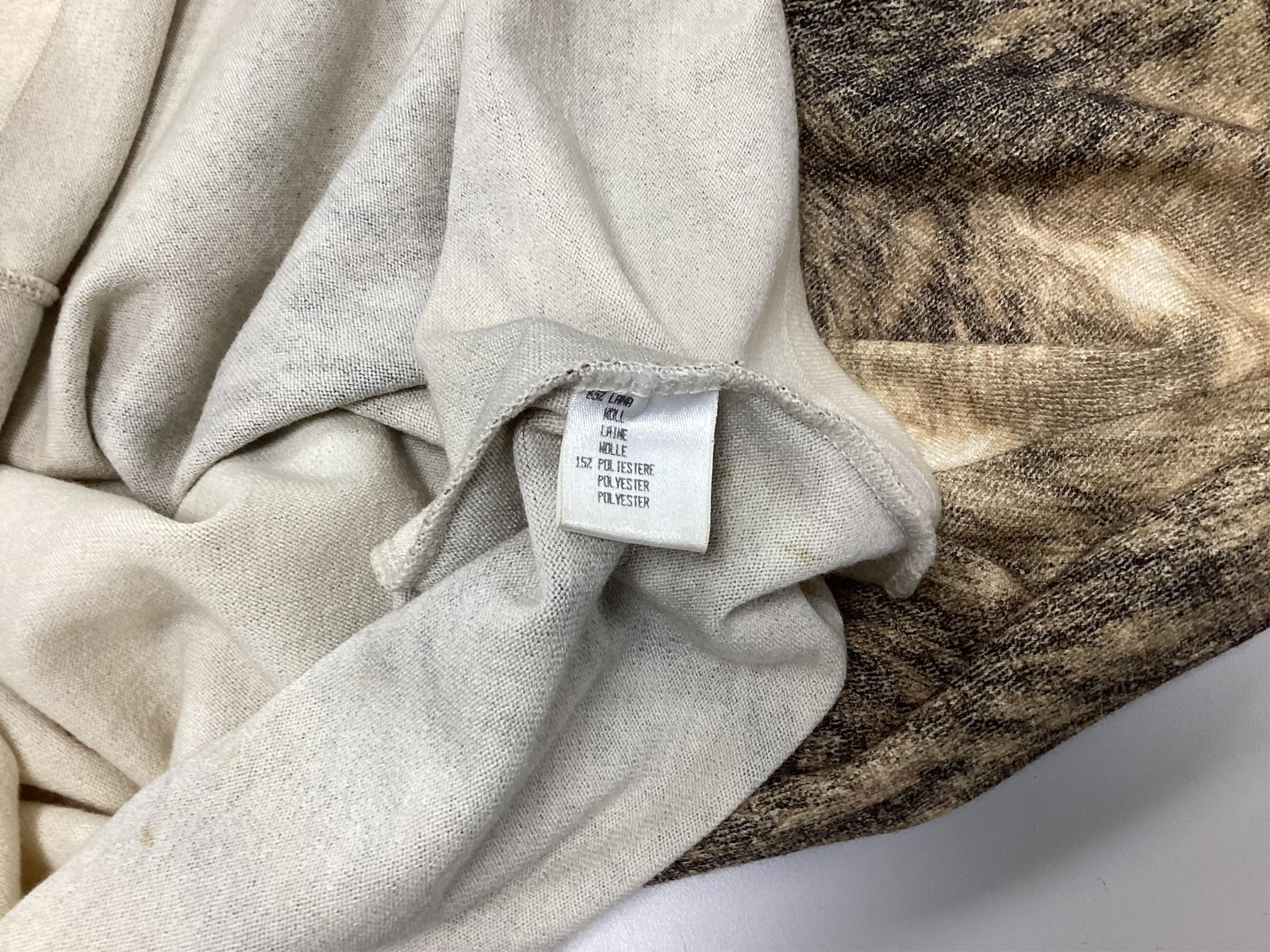 A Roberto Cavalli skirt with matching v neck sweater. Size 14-16 Proceeds to Happy Paws Puppy Rescue